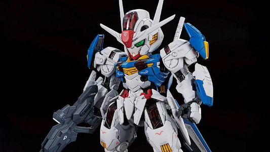 MGSD Gundam Aerial model kit posed with beam rifle and shield bits, featuring white, blue and red armor, metallic inner frame details and clear Shell Unit panels.